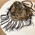 Elegant gold floral print scarf top with fringes on a minimalist white table - Dark Gold