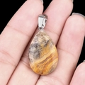 Handheld bumblebee jasper teardrop pendant with silver bail on black background - Crazy Lace Agate (1pc)