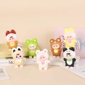 Close-up of 7 cute cartoon figurines in colorful animal onesies on a beige background - Cute Baby Animal Outfit 02 11cm