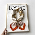 Elegant silk scarf featuring golden lily prints with bright orange borders in a knotted style - 70*70cm / 31212-Orange Edge Lily