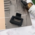 Detailed view of a black matte square hair claw clip on a stylish marble background - Small (approx. 5.5cm) / Black
