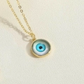 Collana dorata con ciondolo rotondo Evil Eye con pietre di zircone blu e nere - Pendaglio Rotondo / Occhio Blu