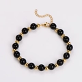 Dettaglio del bracciale di perle in ossidiana occhio di tigre con chiusura a moschettone - Bracciale / Oro