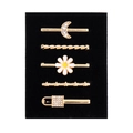 Detailed set of five gold alloy hair pins featuring moon, daisy and star charms - D3015 Moon/Flower/Key Set 5