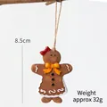 Gingerbread girl Christmas tree ornament with red bow and white cream lace detail - Yellow Bow Gingerbread Man
