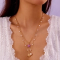 Double-layered gold necklace featuring purple starfish, golden shell, and white pearls - Double-layer Starfish Purple NC25Y0010