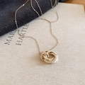 Detail showing the interconnected tricolor rings pendant with sparkling crystal accents - Coffee Gold Trinity Interlocking Ring Pendant (With Zirconia)
