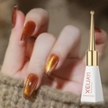 Caramel cat eye gel nail polish on model nails in 10ml bottle with glossy finish - Amber Cat Eye