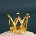 Elegant gold metal crown cake topper with sparkling crystals on a textured coral base - Mini No Rhinestone Gold