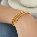 Chic triple-layer gold snake bone textured wrap bracelet in polished stainless steel - Gold Color Bracelet