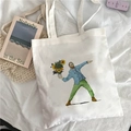 White canvas tote bag with Van Gogh sunflower art print on a white background - Creative Flower Throwing Van Gogh