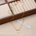 Detailed view of a gold rectangle necklace with a red gemstone and beaded chain design - Gold Square Style (2256)