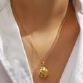 Elegant gold fan-shaped shell pendant necklace with pearl and rhinestones on a model - Pearl Shell (DJN019GL)