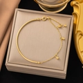 Minimalist gold tassel bead bracelet with half-cuff chain on elegant jewelry box - Gold Half Round Bead Bangle