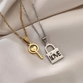 Couples musical note puzzle necklace with gold key and silver lock on silk background - Gold Key Silver Lock Set