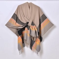 Detailed knit texture of beige plaid poncho with fringe trim and striped jacquard pattern - Colorful Striped Side Tie / Camel