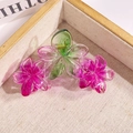 Pink and green gradient triple plumeria hair claw clip on beige woven background - Triple Flower Gradient Rose Red