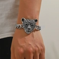 Silver bracelet with crystal leopard head charm featuring green stone eyes and enamel - Silver Green Eyed Leopard Head Black Spotted Rhinestone Bracelet