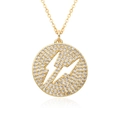 Macro shot of gold-plated lightning bolt circle pendant with sparkling cubic zirconia - Circular Lightning Geometric Style (h237)