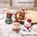 Set of four cute resin Christmas ornaments featuring Santa, elk, and snowman motifs - Christmas Family Figures Set 4 Pieces