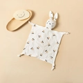 Organic cotton baby security blanket with cherry print and 3D bunny head on beige background - Black Cherry