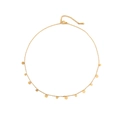 Minimalist gold necklace with small round charms and lobster clasp on white background - Metal Chain