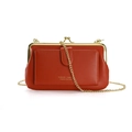 Brick red vintage crossbody bag with gold metal frame closure and fine chain strap - Orange