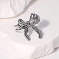 Bague réglable en acier inoxydable argenté pour femme avec un nœud papillon minimaliste - Couleur Acier
