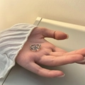 Minimalist S925 silver flower ring with镂空 design shown on palm for women - S925 Silver Hollow Flower Ring (J2930)