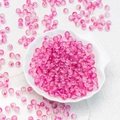 Frosted pink transparent glass beads for DIY jewelry making scattered on shell tray - 8mm Berry Purple with Gold Glitter