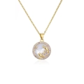Detail of gold-plated Cancer constellation necklace with white shell and purple crystals - Cancer