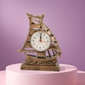 Vintage bronze sailboat desk clock with quartz movement on a pink podium - Bronze Sailboat Alarm Clock