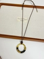 Ethnic style long necklace with gold round pendant featuring tiger pattern fabric wrap - Brown Leopard