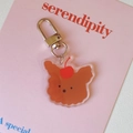 Cute brown acrylic bear keychain with cherry detail on pink decorative card background - Cherry Puppy