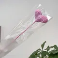Handmade pink crochet heart decor wand wrapped in protective packaging for gift bouquets - Purple Heart Branch