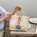 Cartoon monster canvas tote bag with yellow checkered base and durable woven handles - Cute Monster Stack