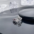 Detailed macro view of silver bow ring with pink triangle gemstone and micro-pave crystals - Style 4 Adjustable Ring