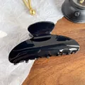 Glossy black acrylic hair claw clip with a sleek streamlined design and polished finish - 9cm / Solid Black