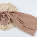 Dusty rose chiffon hijab scarf with crepe texture on a woven mat and white background - 108