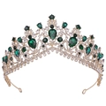 Close-up of golden bridal tiara with emerald crystals and sparkling rhinestones - KC Gold Emerald Green Rhinestone