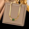 Golden snake chain necklace with green oval gemstone pendant on beige jewelry box - 【xlh1147】green Diamond Snake Bone Necklace (gold)
