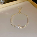 Detail of gold zircon heart bracelet showing sparkling round diamond and pull adjustment buckle - 61# Bracelet-Gold Rhinestone-Round Main Stone