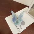 Blue and purple gradient butterfly hair claw clip with golden metal spring on display card - Aurora Blue