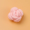 Detailed view of pink hand-crocheted yarn rose with intricate petal textures on orange base - Flesh Pink Rose Head