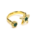 Detail of gold hammer-textured open ring featuring star-shaped green zircon crystals - Adjustable Open / Gold Green Zirconia