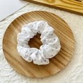 White scrunchie with purple polka dots on a wooden tray for elegant hair styling - White with Purple Polka Dots