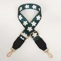 Detail of adjustable green shoulder strap with white daisy pattern and gold swivel hooks - Green Flowers + Black Leather / Silver Hook