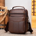 Men's dark brown leather crossbody bag with lychee texture and top handle shown in retro setting - 7456 Brown