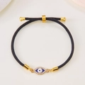 Adjustable black braided rope bracelet featuring a golden evil eye charm with blue inlay - Black Rope-Zirconia Eye(BR24Y0227)