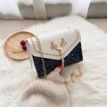 Women's chic chain crossbody bag featuring navy sequins and white leather flap with deer buckle - White